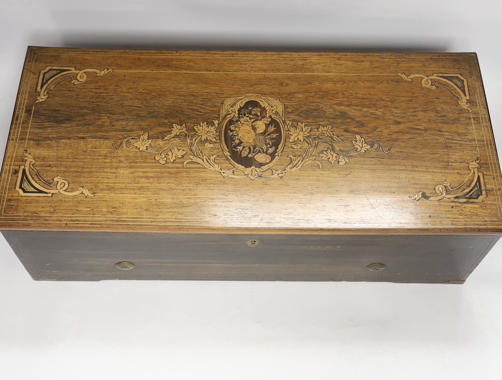A late 19th century Swiss rosewood inlaid cylinder music box by Nicole Freres, playing twelve airs on one hundred and twenty-nine teeth, barrel 31cm wide, case 53cm wide, 22.5cm deep, 17cm high